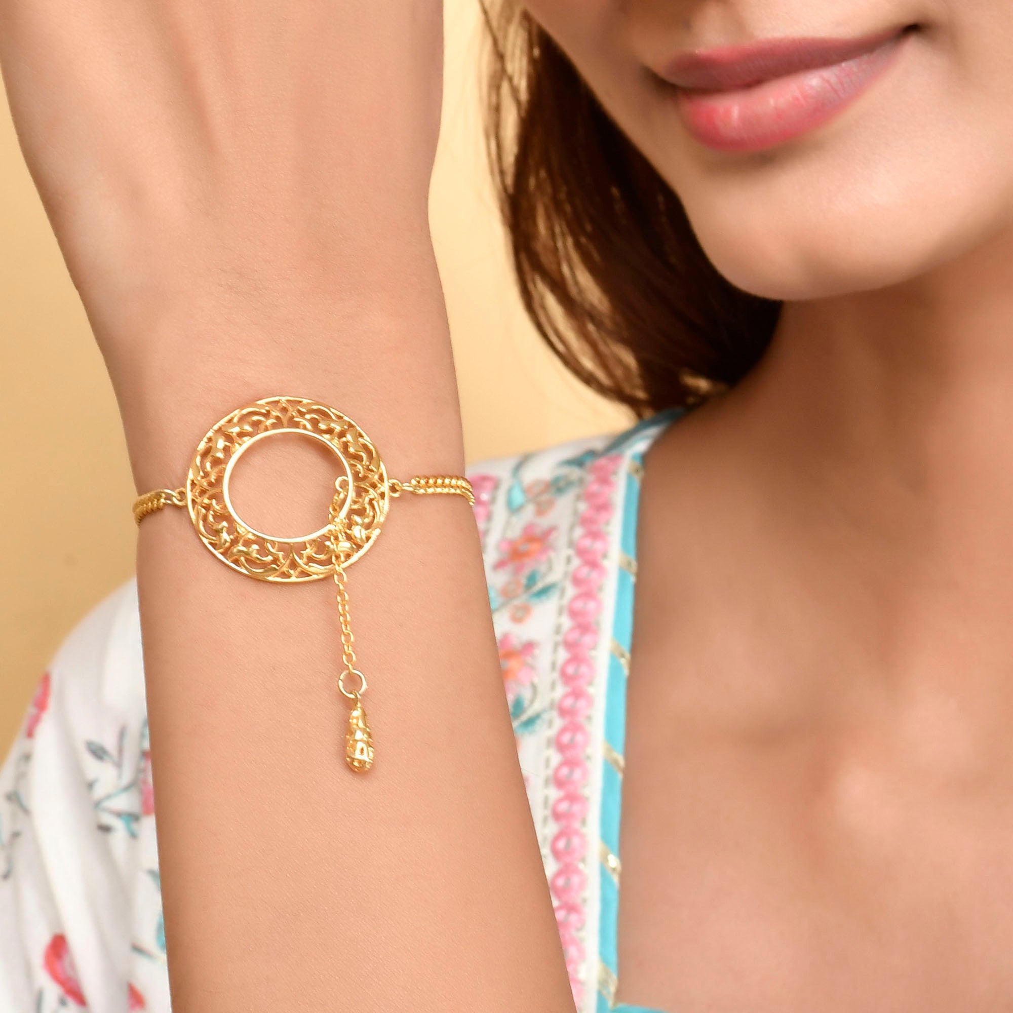 Gold Finish Bracelet with Zircon Setting at the Centre – VOYLLA