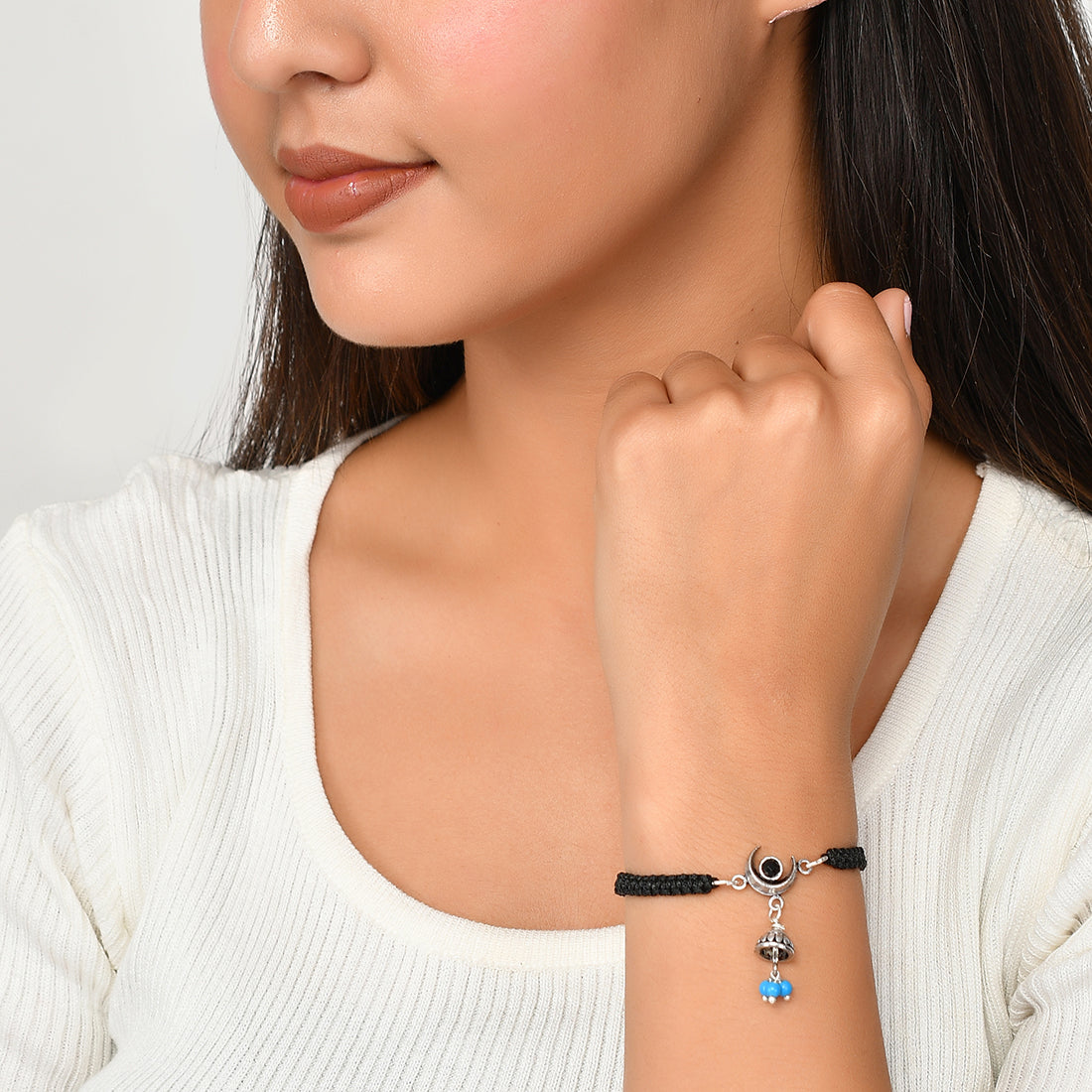 Chained & Able slim beaded bracelet with hanging cross in black | ASOS